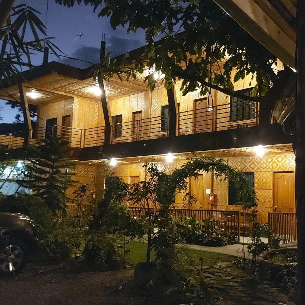 Oslob New Village Lodge's garden-view rooms with private balconies for a tranquil stay.