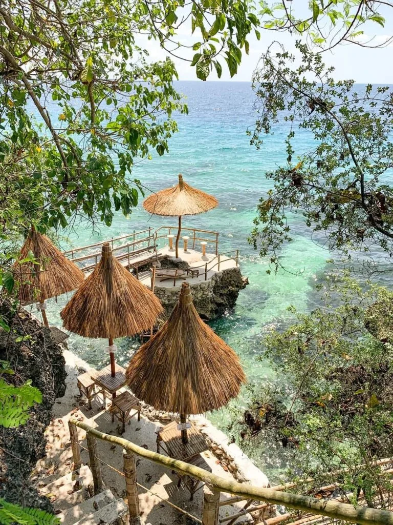 Stay N Save B&B's cozy beachfront accommodations nestled amidst lush greenery in Oslob.